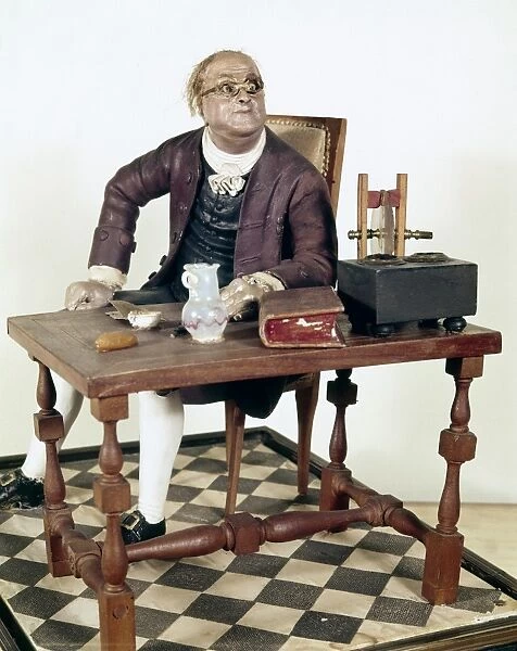 BENJAMIN FRANKLIN (1706-1790). American printer, publisher, scientist, inventor, statesman and diplomat. Painted wood statuette, American, 19th century