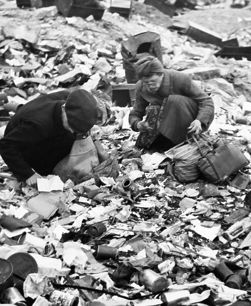 BERLIN, 1945. Women searching for food in a garbage dump in Berlin, Germany