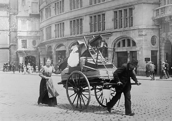 BERLIN: MOVING DAY, c1915. A couple moving their household in Berlin, Germany. Photograph