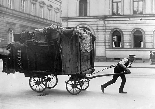 BERLIN: MOVING DAY, c1915. A man moving his household in Berlin, Germany. Photograph