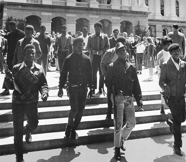 BLACK PANTHERS, 1967. Armed Black Panthers on the steps of the California state capitol, protesting a bill banning the carrying of loaded firearms, 2 May 1967