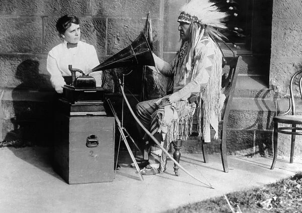 BLACKFOOT AND PHONOGRAPH. Mountain Chief (Ninastoko), chief of the Blackfoot Native