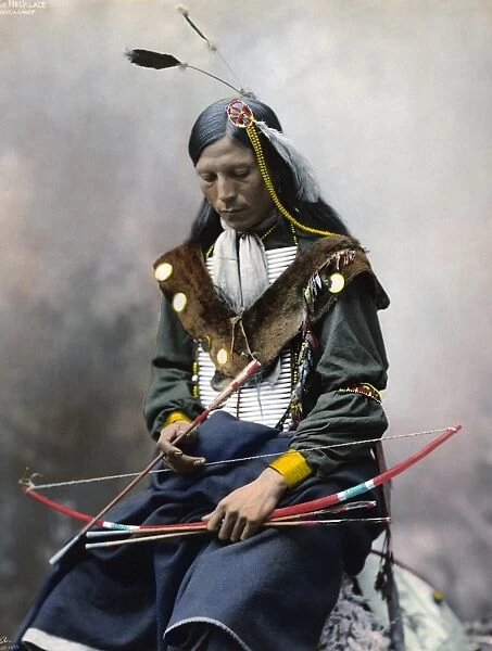 BONE NECKLACE, c1899. Oglala Sioux chief. Hand colored platinum print photograph, c1899