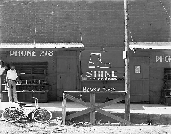 BOOTBLACK STAND, 1936. A shoeshine stand in the southeast