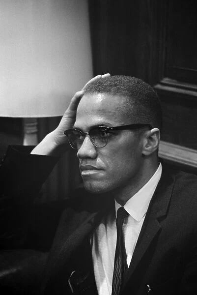 Born Malcolm Little. American religious and political leader. Photographed by Marion Trikosko while waiting at a press conference given by Dr. Martin Luther King, Jr. in Washington, D. C. 26 March 1964