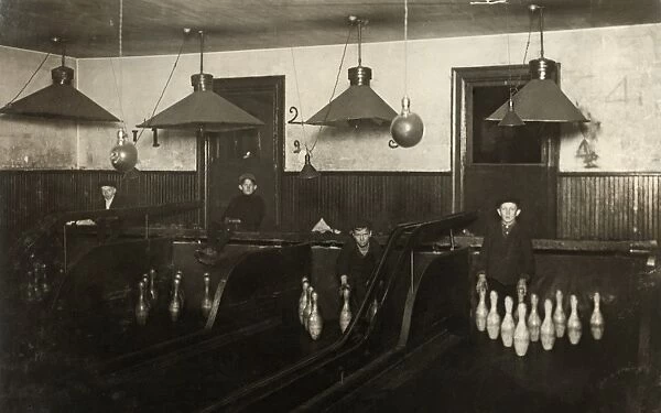 BOWLING ALLEY, c1908. Pin boys working at a bowling alley until late at night in Pittsburgh