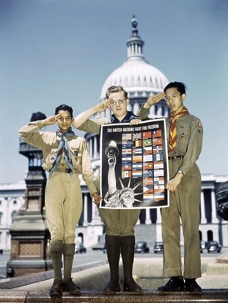 BOY SCOUTS, 1943. Boy Scouts holding a poster for the United Nations Fight for