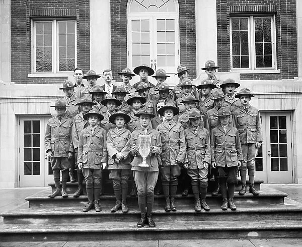 BOY SCOUTS, c1920. A group of Boy Scouts with a trophy. Photograph, c1920
