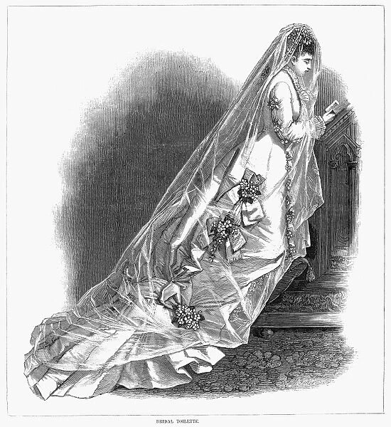 BRIDAL GOWN, 1876. Wood engraving from an American womens magazine of 1876