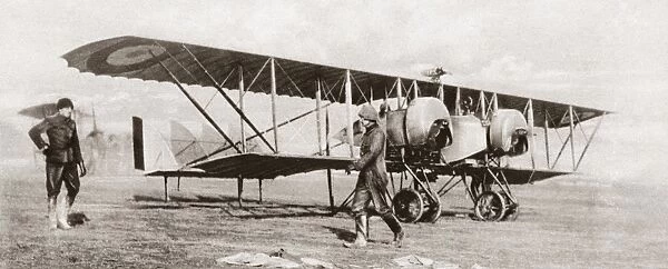 A British biplane equipped with a radio transmitter, at an airfield in France during World War I. Photograph, c1916