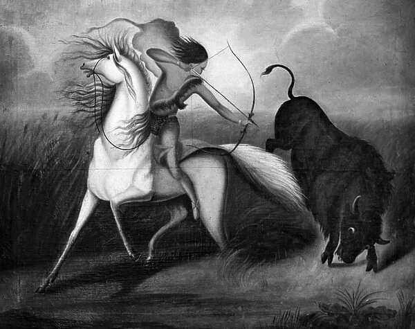 BUFFALO HUNT, c1844. A Native American hunter taking aim at a buffalo on the Great Plains