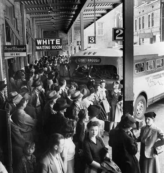 BUS TERMINAL, 1943. Passengers in the whites only waiting area at the Greyhound