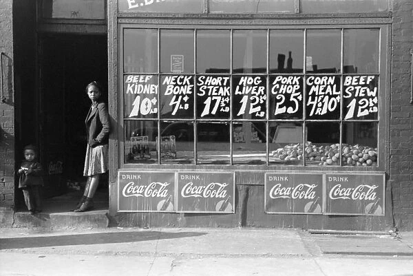 BUTCHER SHOP, c1939. Exterior of a butcher shop, probably Chicago, Illinois. Photograph