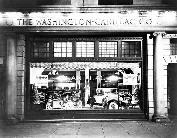 CADILLAC STOREFRONT, 1927. Cadillac automobiles in a store window in Washington, D. C. 1927