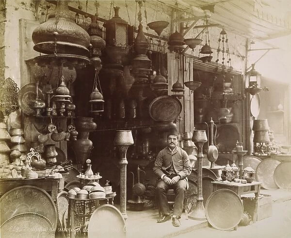 CAIRO: BAZaR, 1890s. A merchant in the Brass Bazaar of Cairo, Egypt, 1890s