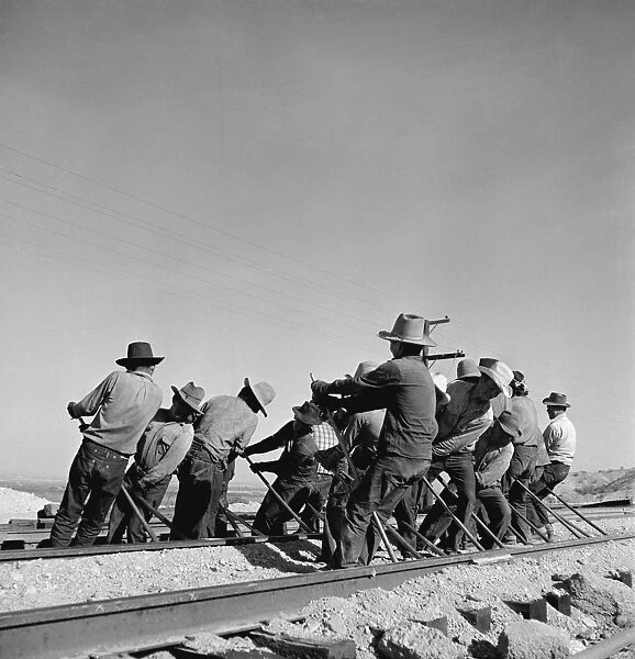 CALIFORNIA: RAILWAY, c1943. An Indian section gang at work on the tracks in the Atchison