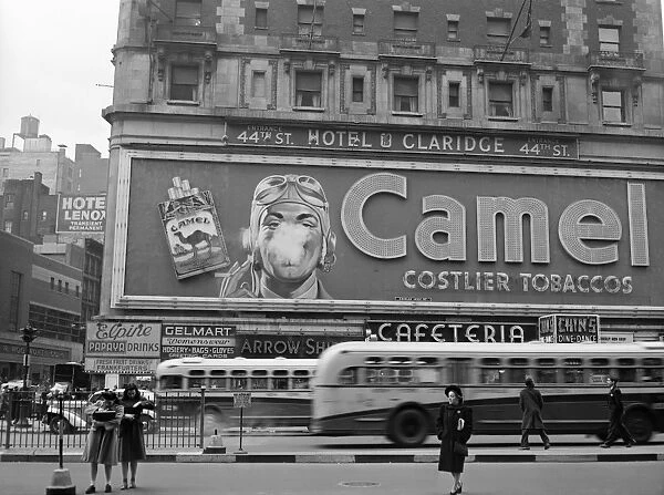 CAMEL ADVERTISEMENT, 1943. A billboard for a Camel cigarette advertisement in Times Square