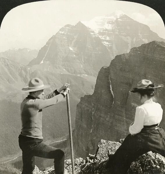 CANADA: ROCKY MOUNTAINS. Two climbers looking at Mount Temple in the Rocky Mountains