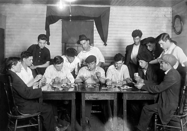 CARD GAME, 1916. A group of young Portuguese-American mill workers from Fall River