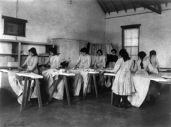 CARLISLE SCHOOL, c1901. Ironing class at the Carlisle Indian School in Carlisle, Pennsylvania