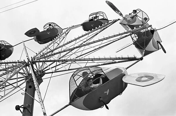 CARNIVAL RIDE, 1942. An airplane carnival ride, Brownsville, Texas. Photograph by Arthur Rothstein, Febraury 1942