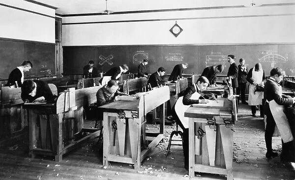 CARPENTRY CLASS, 1899. Carpentry class in the manual training room at a high school in Holyoke