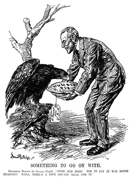 Cartoon depicting American President Woodrow Wilson serving the German eagle Humble Pie. British cartoon by Bernard Partridge, c1915