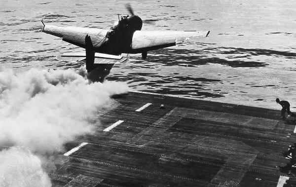 Catapulted by Jet Assisted Take-off (JATO), a carrier based Grumman TBF Avenger of the U. S. Navy takes off over the Pacific Ocean during World War II