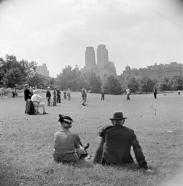 CENTRAL PARK, 1942. Sitting on the lawn in Central Park in New York City