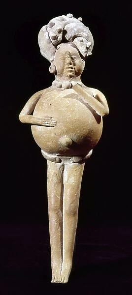 Ceramic rattle in the shape of a man, whose belly was filled with seeds. From Jaina, Campeche, Mexico, 200-900 A. D. Height: 18. 5 cm