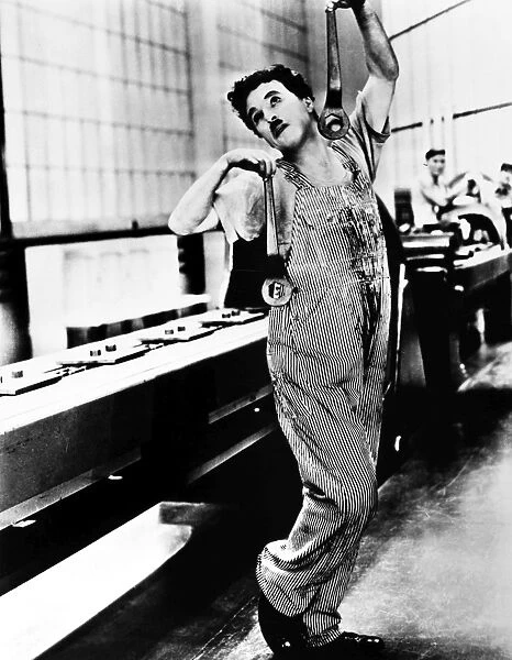 CHAPLIN: MODERN TIMES, 1936. Charlie Chaplin in a scene from the film Modern Times, 1936