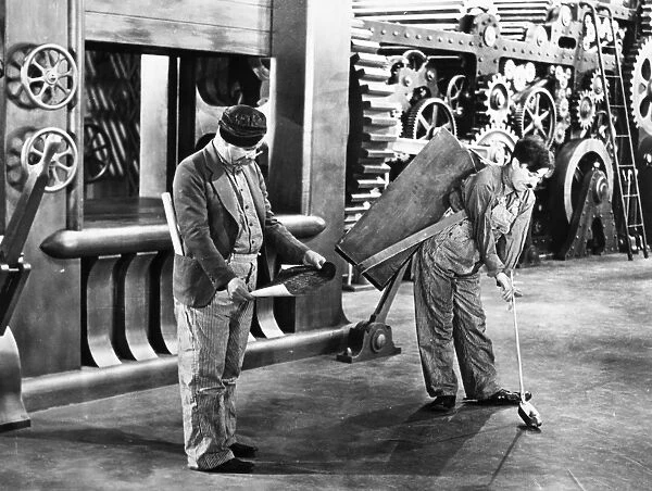 CHAPLIN: MODERN TIMES, 1936. Charlie Chaplin in a scene from the film, Modern Times, 1936