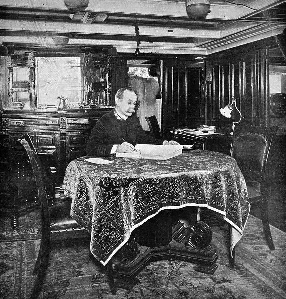 CHARLES DWIGHT SIGSBEE (1845-1923). American naval officer. In his cabin aboard the USS Maine
