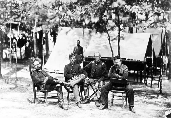 CHARLES F. ADAMS, JR. (1835-1915). American historian. Captain Charles Francis Admas Jr. (on left) with fellow officers of the First Massachusetts Cavalry of the Union Army at the Army of the Potomac Headquarters in Petersburg, Virginia, during the American Civil War, August 1864. Photgraphed by Timothy O Sullivan