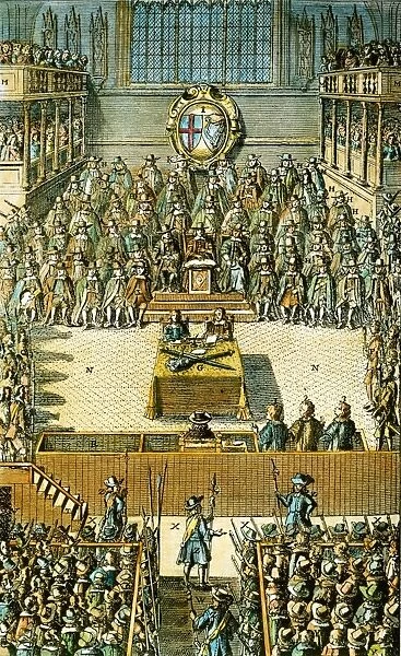 CHARLES I ON TRIAL. King Charles I of England (seated alone just before center) on trial before a specially constituted high court of justice in Westminster Hall on 20 January 1649. Colored English engraving, 1684