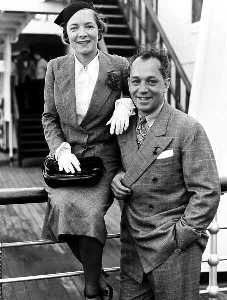 CHARLES MACARTHUR (1895-1956). American journalist and playwright. Photographed with his wife, actress Helen Hayes, aboard the ocean liner Queen Mary, August 1936