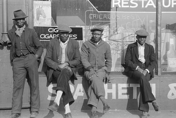 CHICAGO: MEN, 1941. Group of African American men in front of a storefront in Chicago, Illnois