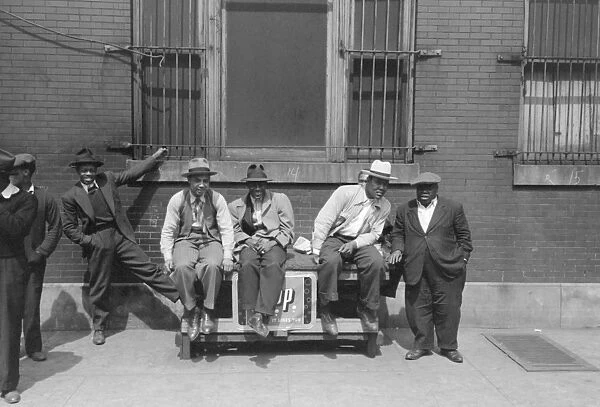 CHICAGO: MEN, 1941. Men pose for a photograph on the street in Chicago, Illinois
