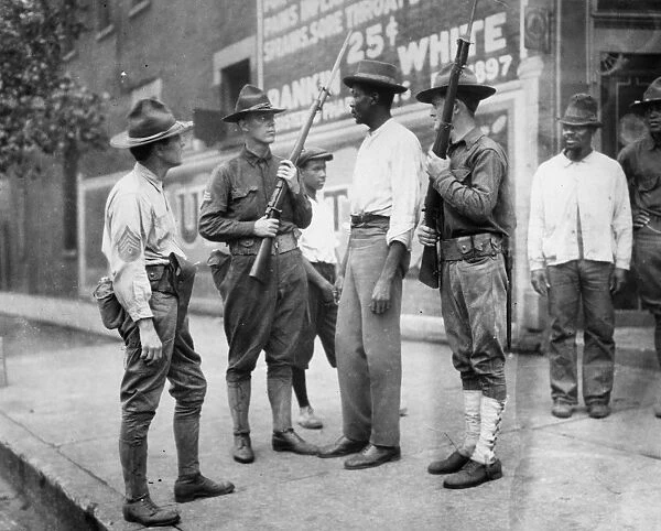 CHICAGO: RACE RIOT, 1919. National Guardsmen questioning an African American man