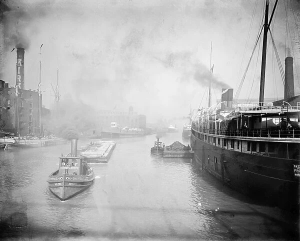 CHICAGO RIVER, c1905. A view of boats on the Chicago River from Rush Street Bridge