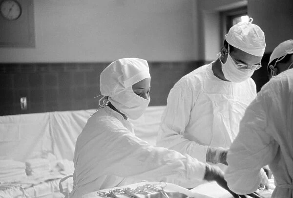 CHICAGO: SURGERY, 1941. A nurse assisting a hernia operation at Provident Hospital