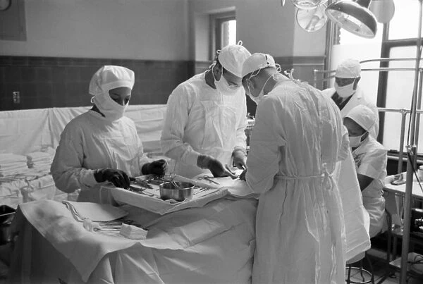 CHICAGO: SURGERY, 1941. Surgeons performing an operation at Provident Hospital