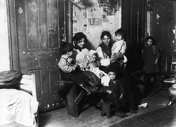 CHICAGO: TENEMENT, 1910. Italian immigrant family in a tenement home, Chicago, Illinois
