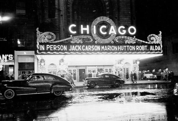 CHICAGO: THEATER, 1949. People arriving at a movie theater for a show starring