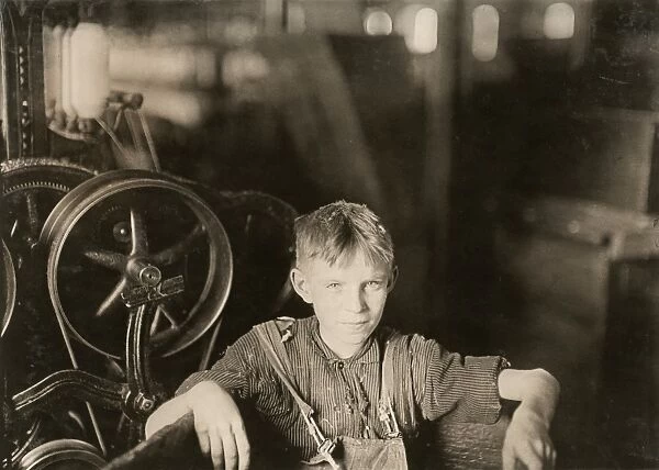CHILD LABOR, 1909. One of the young spinners in the Quidwick Co. Mill in Anthony, Rhode Island