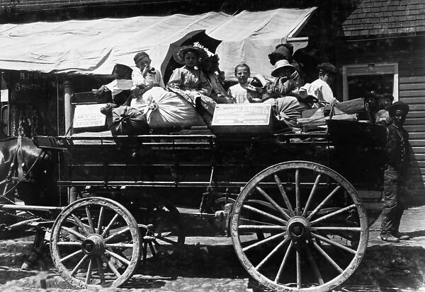 CHILD LABOR, c1910. Child berry pickers in a wagon belonging to the Maryland Biscuit Company