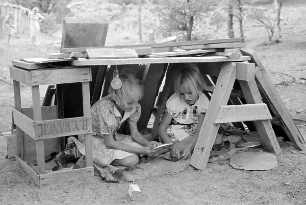CHILDREN PLAYING, 1940. The Whinery children playing in their home in Pie Town, New Mexico