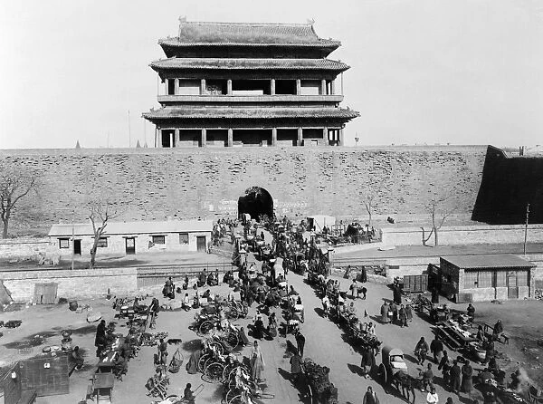 CHINA: PEKING, c1900. A aerial view of busy street scene in front of Hata-men Gate, Peking, China