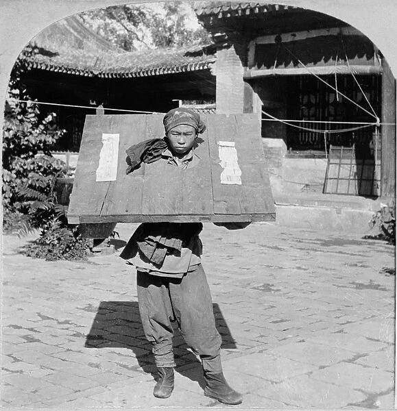CHINA: PRISONER, c1900. A captured prisoner from the Boxer Rebellion, locked in