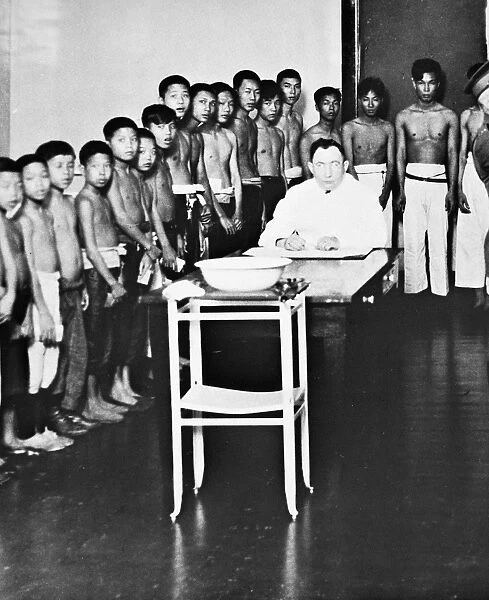 Chinese boys awaiting medical examinations at Angel Island immigration station in San Francisco Bay, c1910